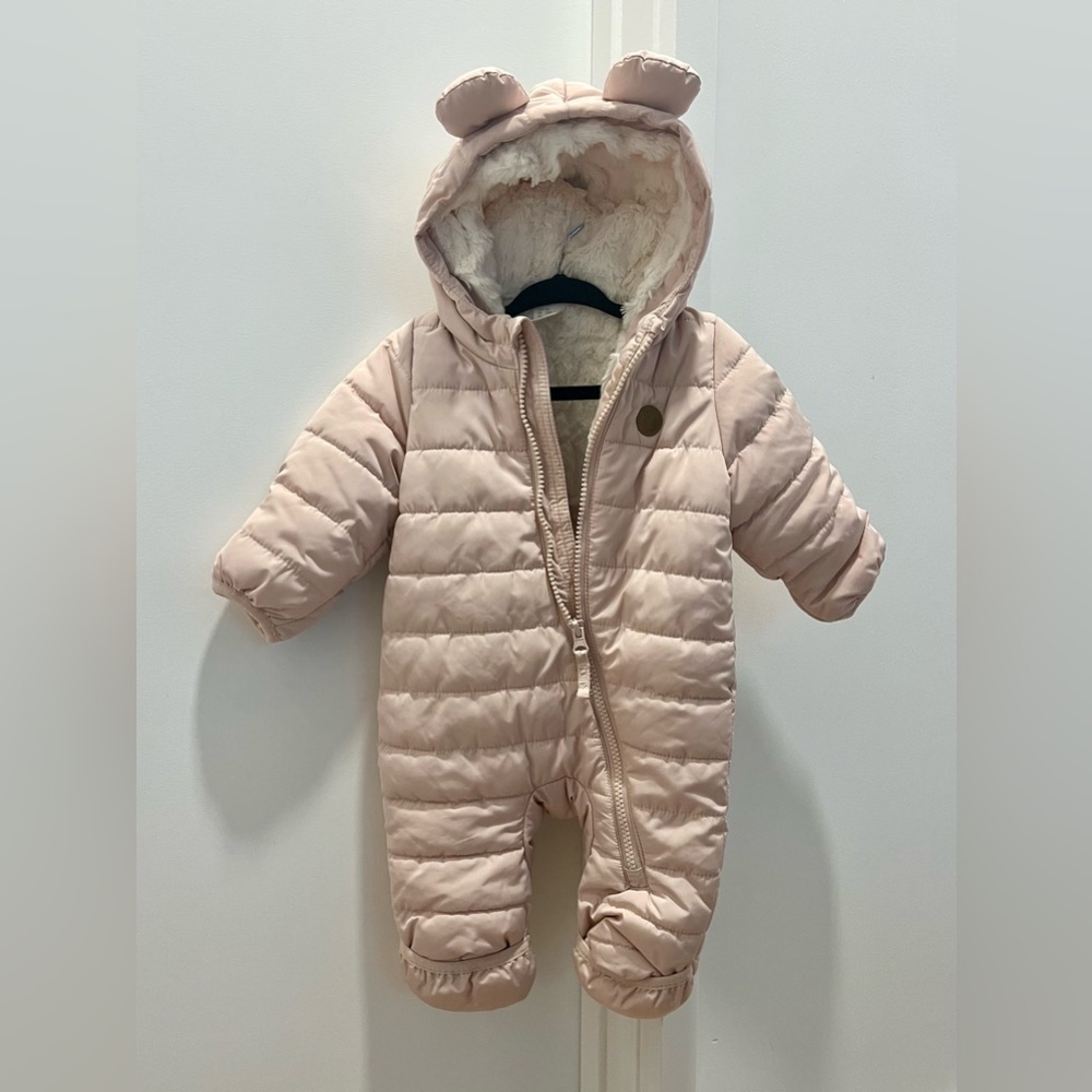 The sweetest bunting snowsuit in pale pink.